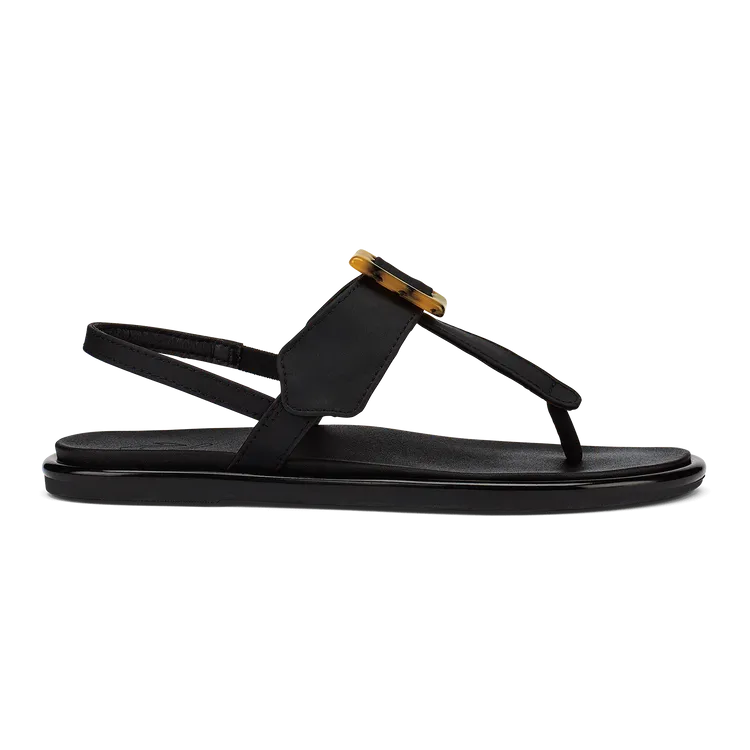 OluKai La'i T-Bar Women's Sandal in Black/Black — stretchable strap, tubular toe post, tortoise shell buckle, cushioned footbed, back strap design