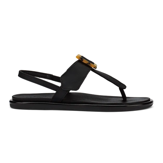 OluKai La'i T-Bar Women's Sandal in Black/Black — stretchable strap, tubular toe post, tortoise shell buckle, cushioned footbed, back strap design