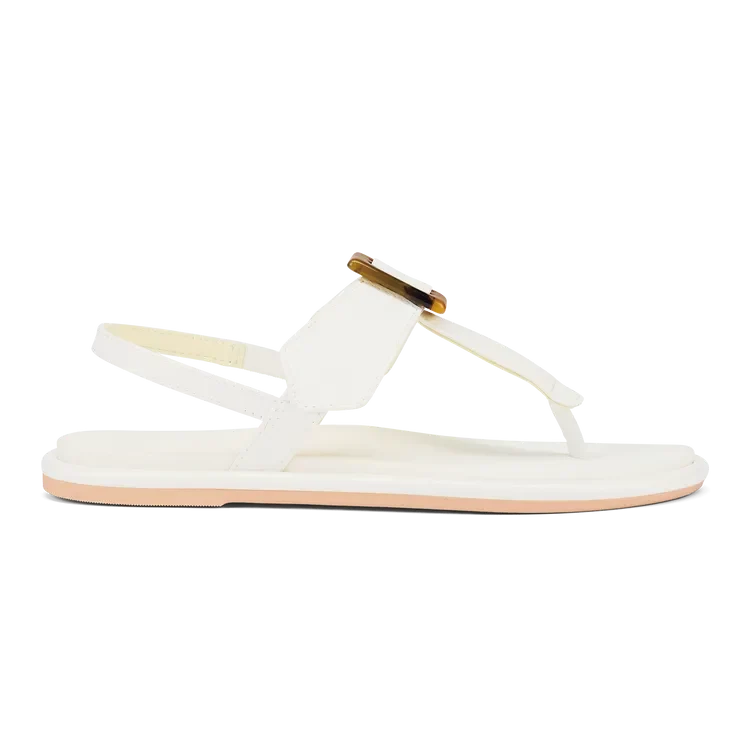 OluKai La'i T-Bar Women's Sandal in White/White — stretchable strap, tubular toe post, tortoise shell buckle, cushioned footbed, back strap design