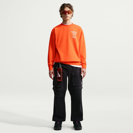 Nike ACG Tuff Fleece Men's Dri-FIT Crew-Neck Sweatshirt in Safety Orange/White — unbrushed French Terry fleece, roomy fit, moisture-wicking
