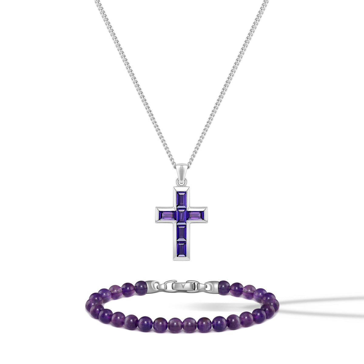 Silver cross pendant with purple accents and a matching bracelet on a white background