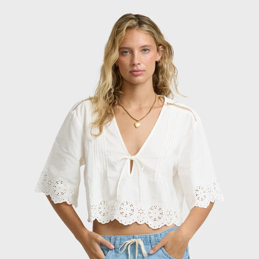 Billabong Light and Airy Short Sleeve Cotton Blouse in Salt Crystal — 100% cotton poplin, eyelet lace border, pintuck detail, self-tie front, floaty fit