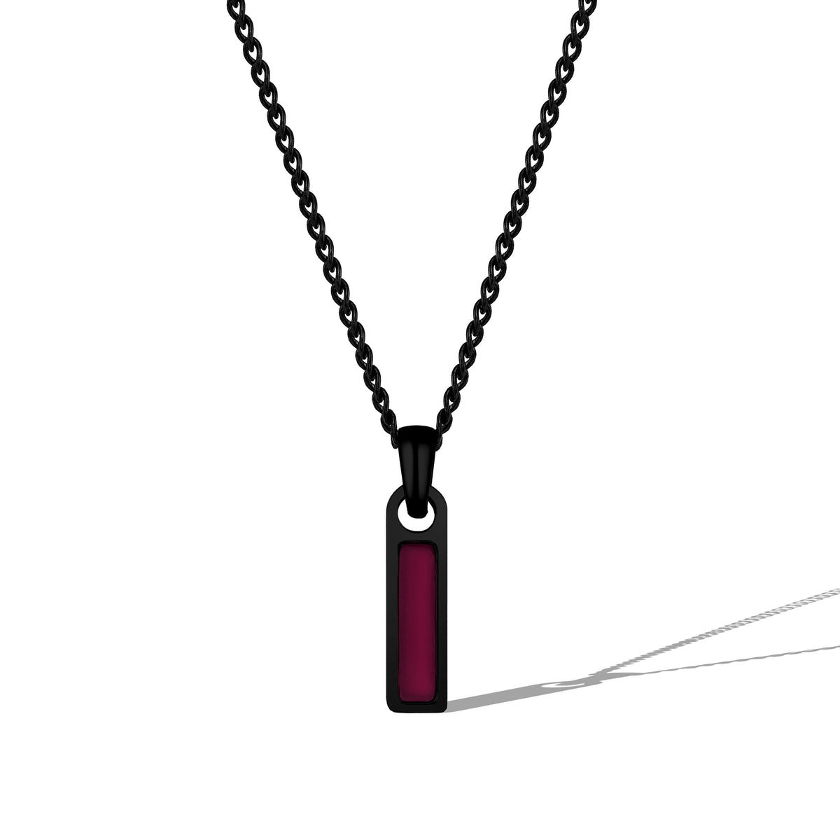 Black chain necklace with a red pendant on a white background