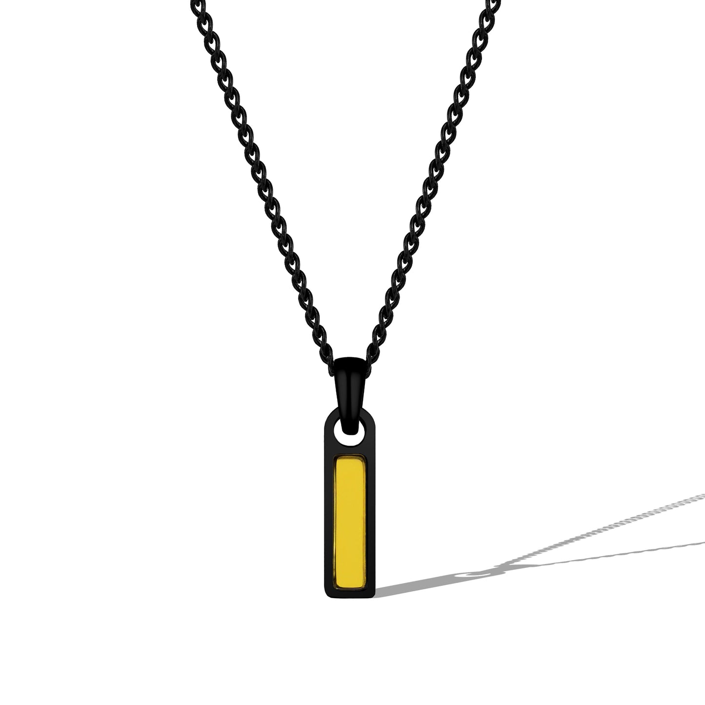 Necklace with a black chain and yellow pendant on a white background