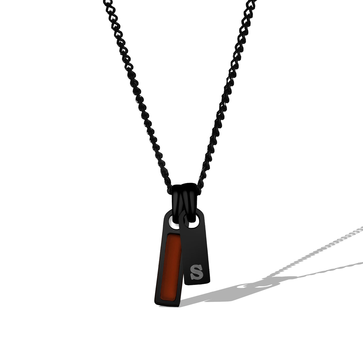 Black chain necklace with a pendant featuring a red accent on a white background