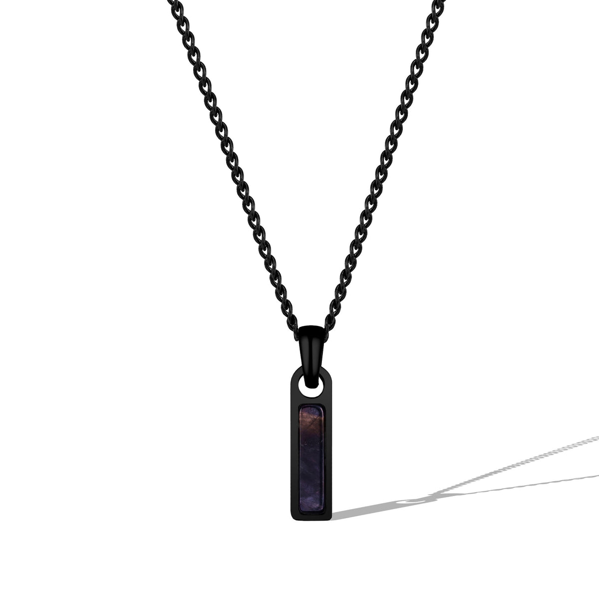 Black necklace with a pendant on a white background
